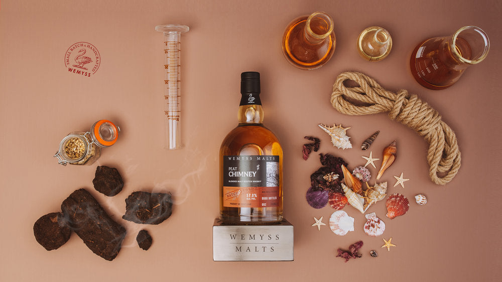 Peat Chimney Batch Strength surrounded by ingredients to represent the flavour profile